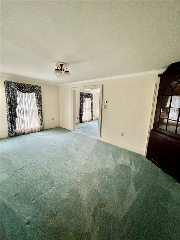 unfurnished room featuring crown molding, a textured ceiling, and carpet flooring