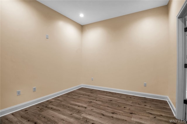 spare room with hardwood / wood-style floors