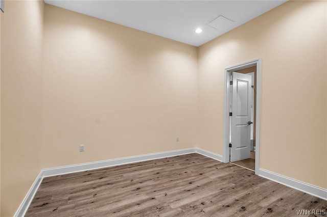 empty room with hardwood / wood-style floors