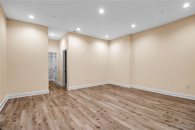 spare room featuring light wood-type flooring