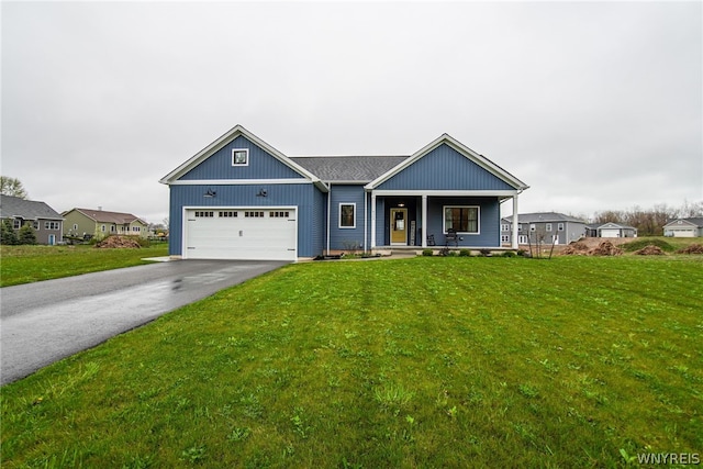 view of front facade with a garage and a front yard