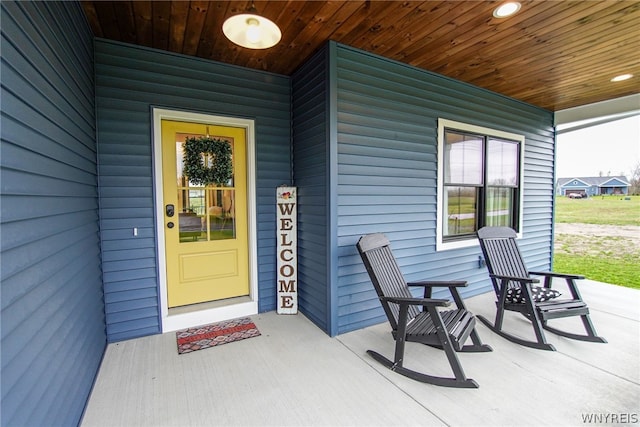 doorway to property with covered porch