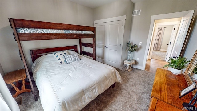 carpeted bedroom featuring a closet