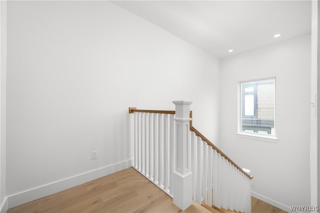 stairs featuring light hardwood / wood-style flooring