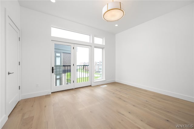 spare room featuring light hardwood / wood-style flooring