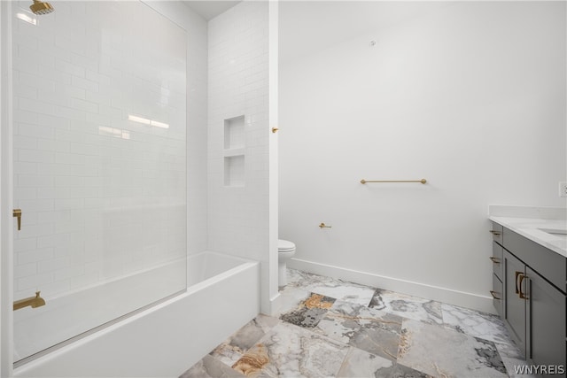 full bathroom featuring tile floors, tiled shower / bath, vanity, and toilet