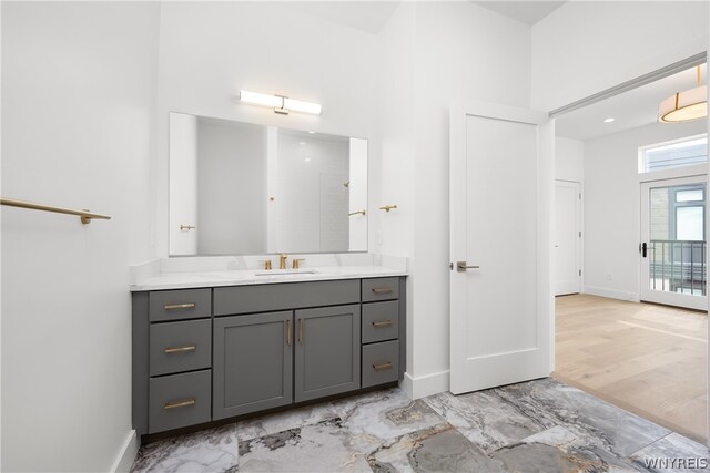 bathroom with vanity and tile flooring