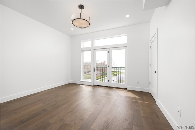 unfurnished room featuring french doors and dark hardwood / wood-style floors