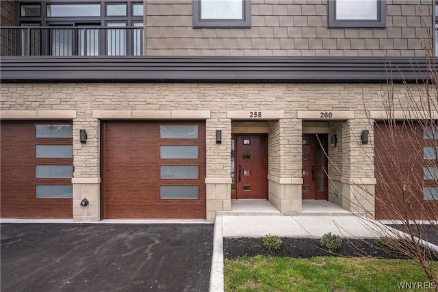 view of exterior entry featuring a garage