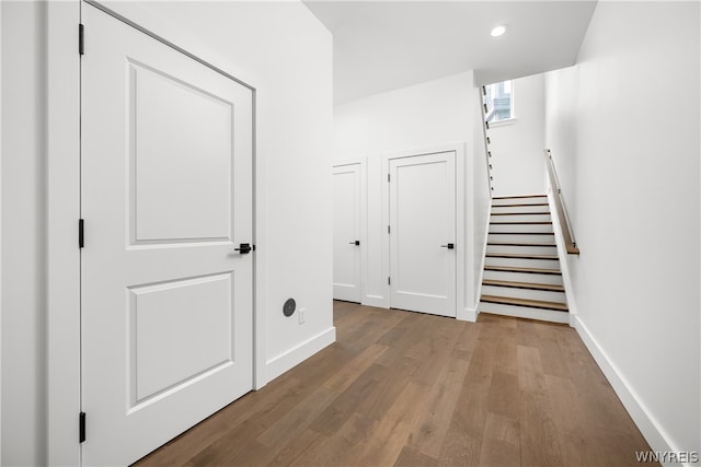 stairway with wood-type flooring