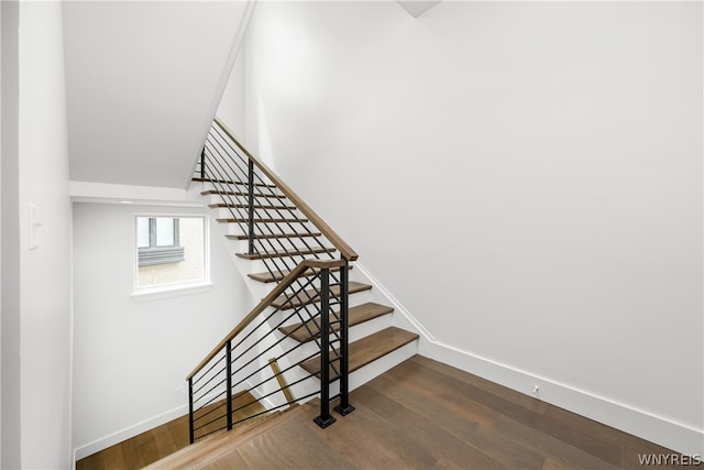 stairway featuring hardwood / wood-style flooring