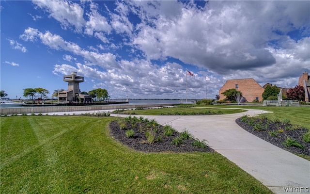 view of home's community featuring a lawn