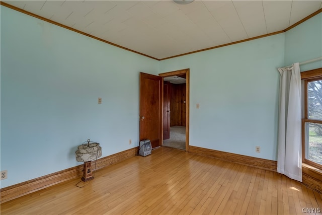 unfurnished room featuring a wealth of natural light and light hardwood / wood-style floors