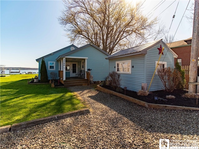 bungalow-style home with a water view, a porch, and a front yard