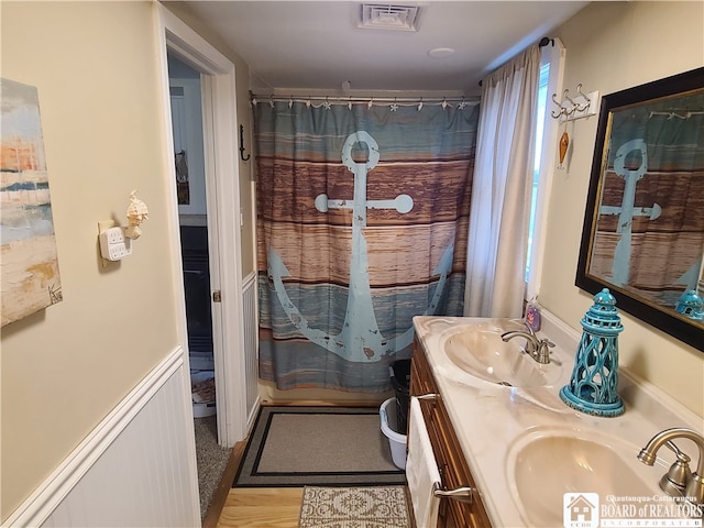 bathroom featuring double sink vanity