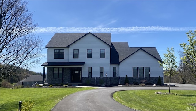 view of front facade with a front yard