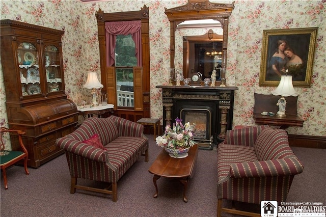 living area with carpet floors and an inviting chandelier