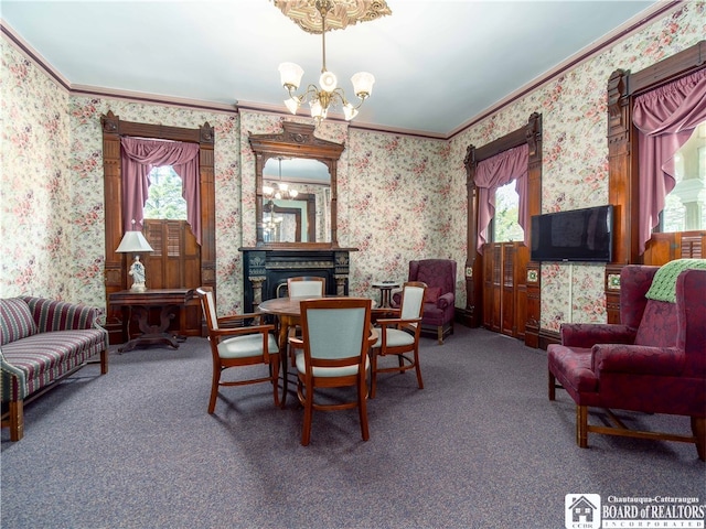 carpeted dining room featuring a chandelier, plenty of natural light, and crown molding