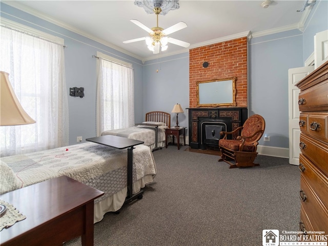 bedroom featuring a wood stove, ceiling fan, ornamental molding, and carpet flooring