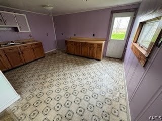 kitchen featuring light tile floors