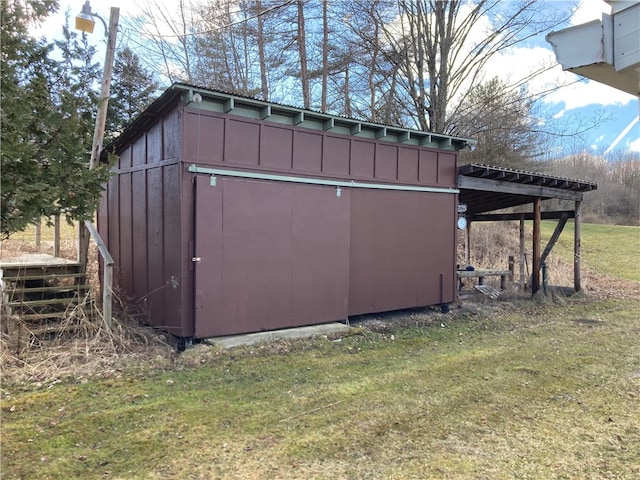 view of outbuilding featuring a lawn