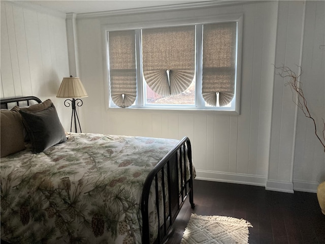 bedroom featuring dark hardwood / wood-style floors