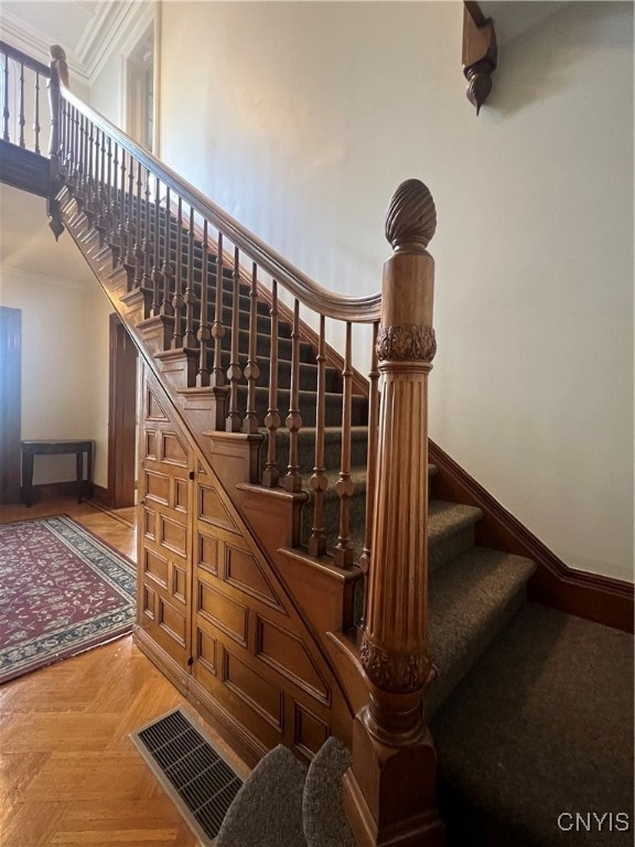 stairway with parquet flooring