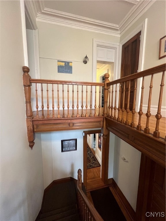 staircase with crown molding