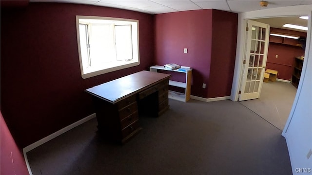 unfurnished office featuring a paneled ceiling