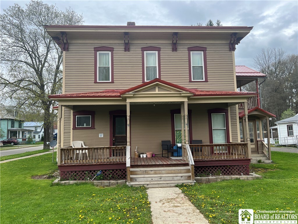 57 W Main St, Friendship, NY 14739 - view of front facade featuring covered porch and a front lawn