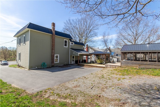 view of side of property with a sunroom