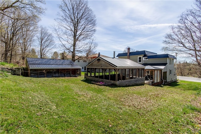 view of yard with a sunroom