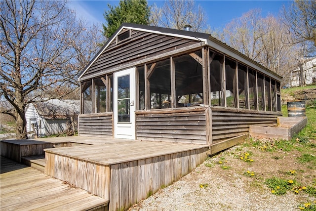 exterior space featuring a sunroom