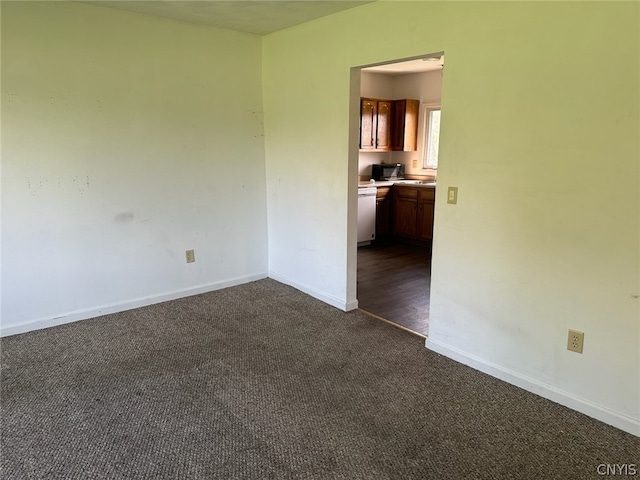 empty room with dark carpet