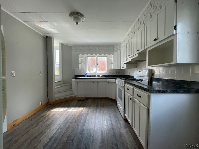 kitchen featuring white cabinets, sink, tasteful backsplash, dark hardwood / wood-style flooring, and white range with gas stovetop