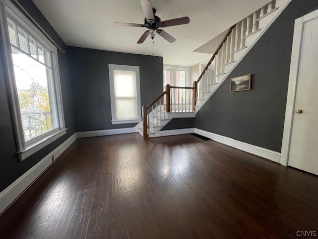 unfurnished room featuring ceiling fan and dark hardwood / wood-style floors