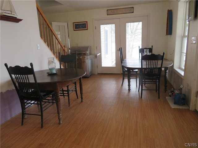 dining room featuring hardwood / wood-style floors and plenty of natural light