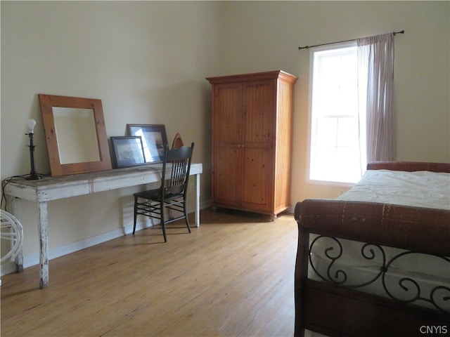 bedroom with light wood-type flooring