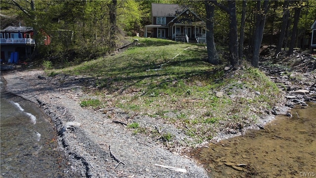 view of yard with a water view