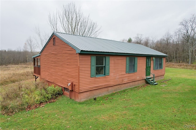 view of property exterior featuring a lawn