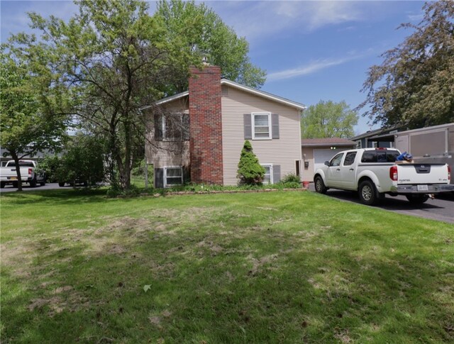 view of side of property with a lawn