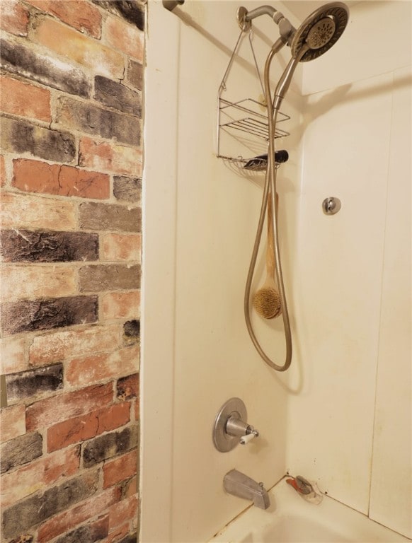 interior details with shower / bathtub combination