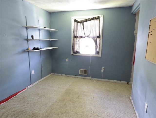 spare room featuring carpet flooring