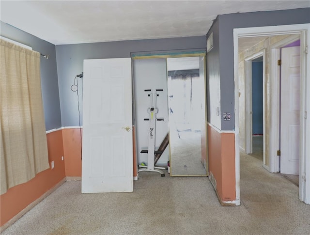 carpeted bedroom featuring a closet