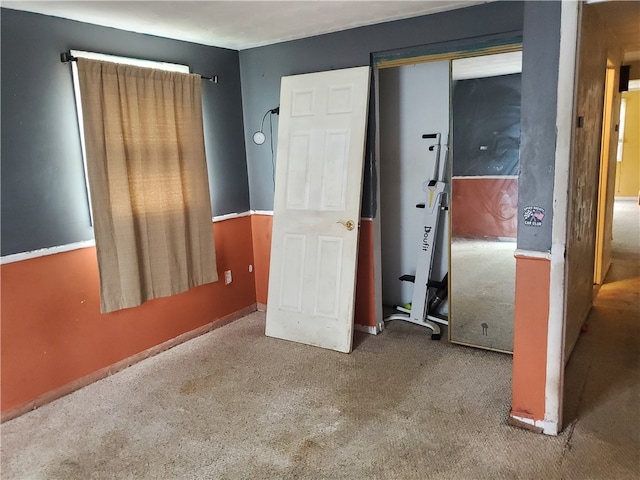 unfurnished bedroom with carpet floors