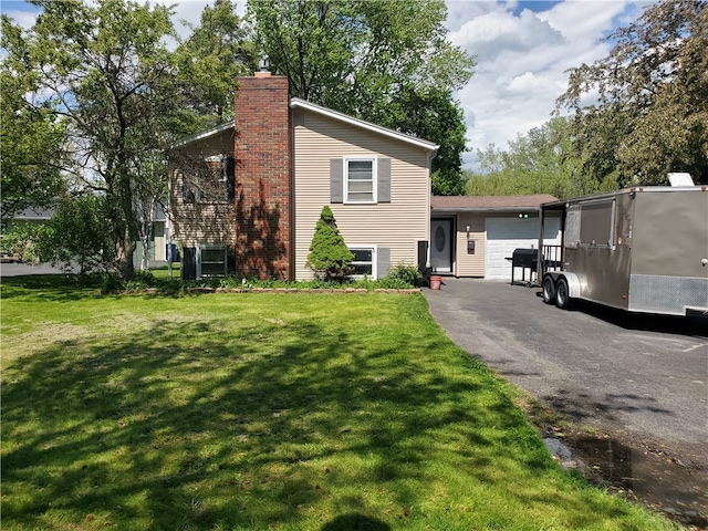 view of side of home featuring a lawn