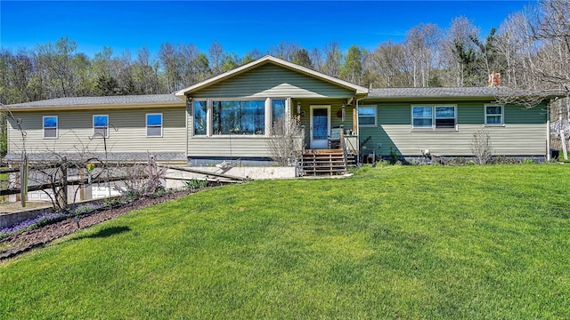 view of front of home with a front lawn