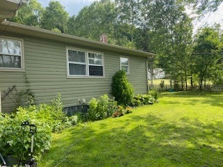 view of home's exterior featuring a yard