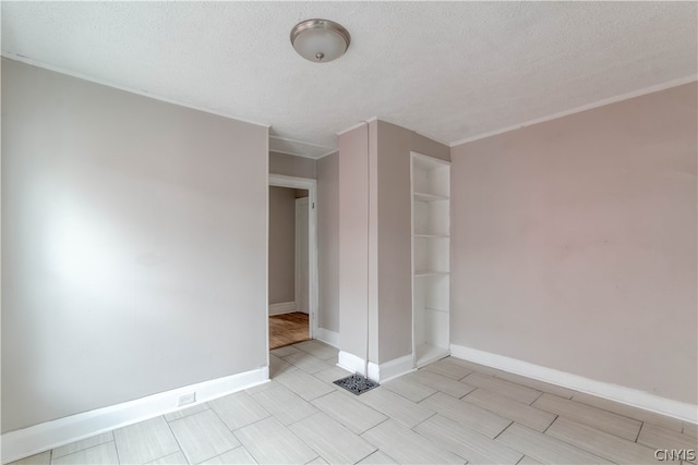 empty room with a textured ceiling