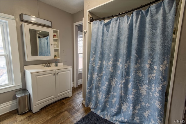 bathroom with oversized vanity and hardwood / wood-style flooring